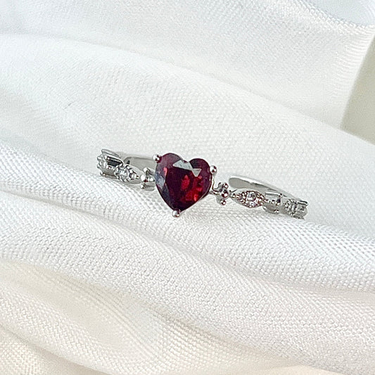 The Red Heart Diamond Silver Ring is a captivating symbol of love and passion. Crafted in luxurious gold, this stunning ring features a striking red heart-shaped diamond at its center, radiating warmth and elegance. The diamond's vivid color is complemented by the gleam of the gold band, creating a perfect blend of romantic charm and timeless beauty. Whether it's a gift for a loved one or a meaningful personal treasure, this ring is designed to make a statement of love, passion, and enduring commitment.